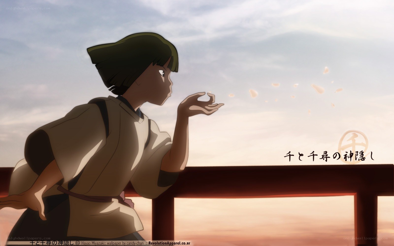 Girl blowing petals at sunset