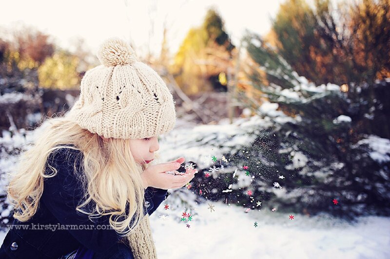 Girl Blowing Snowflakes