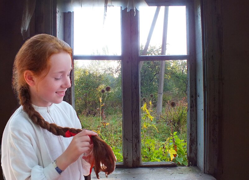 Girl Braiding Hair