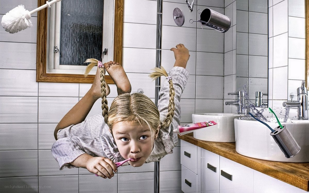 Girl brushing teeth in bathroom