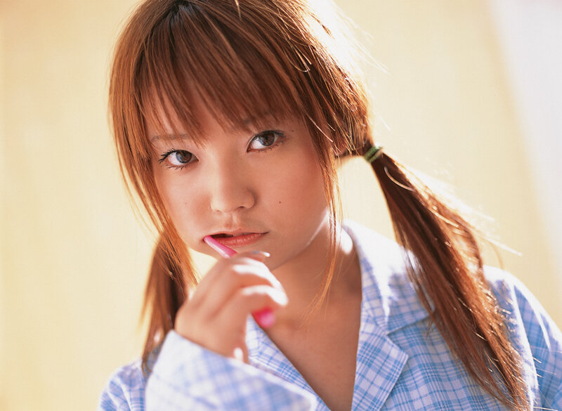 girl brushing teeth in pajamas