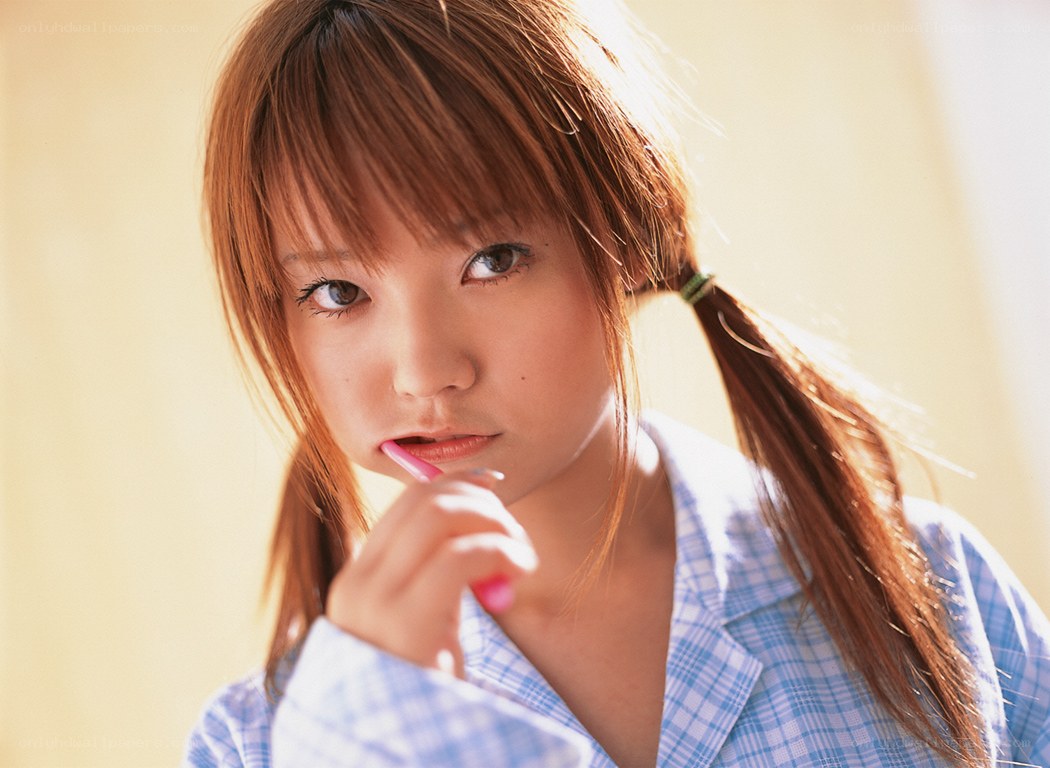 girl brushing teeth in pajamas