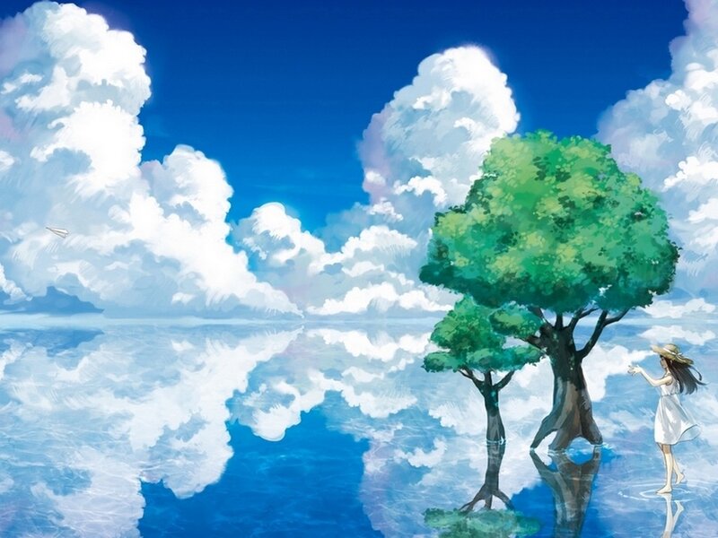 Girl by a tree in a dreamy landscape