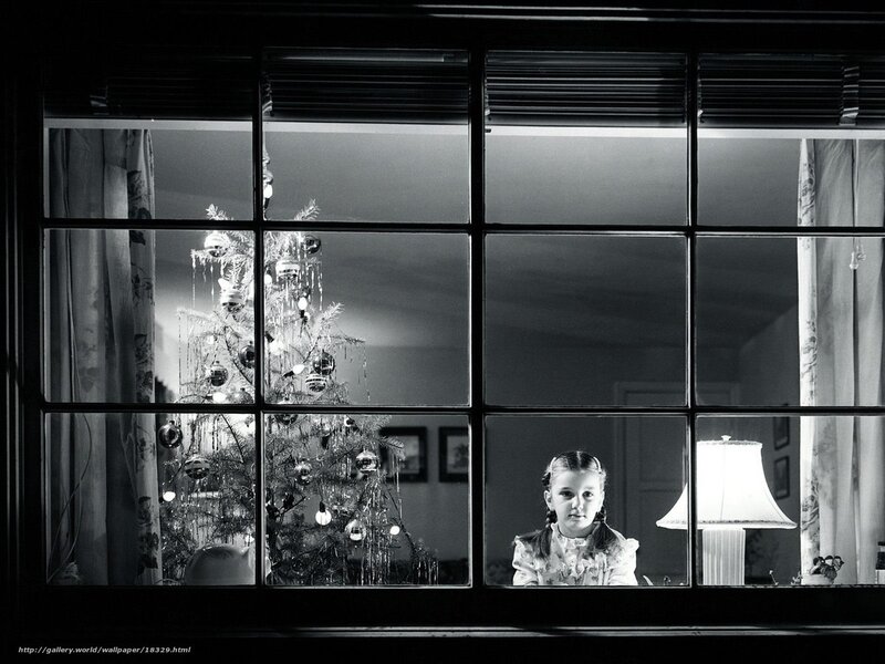 Girl by the Christmas tree