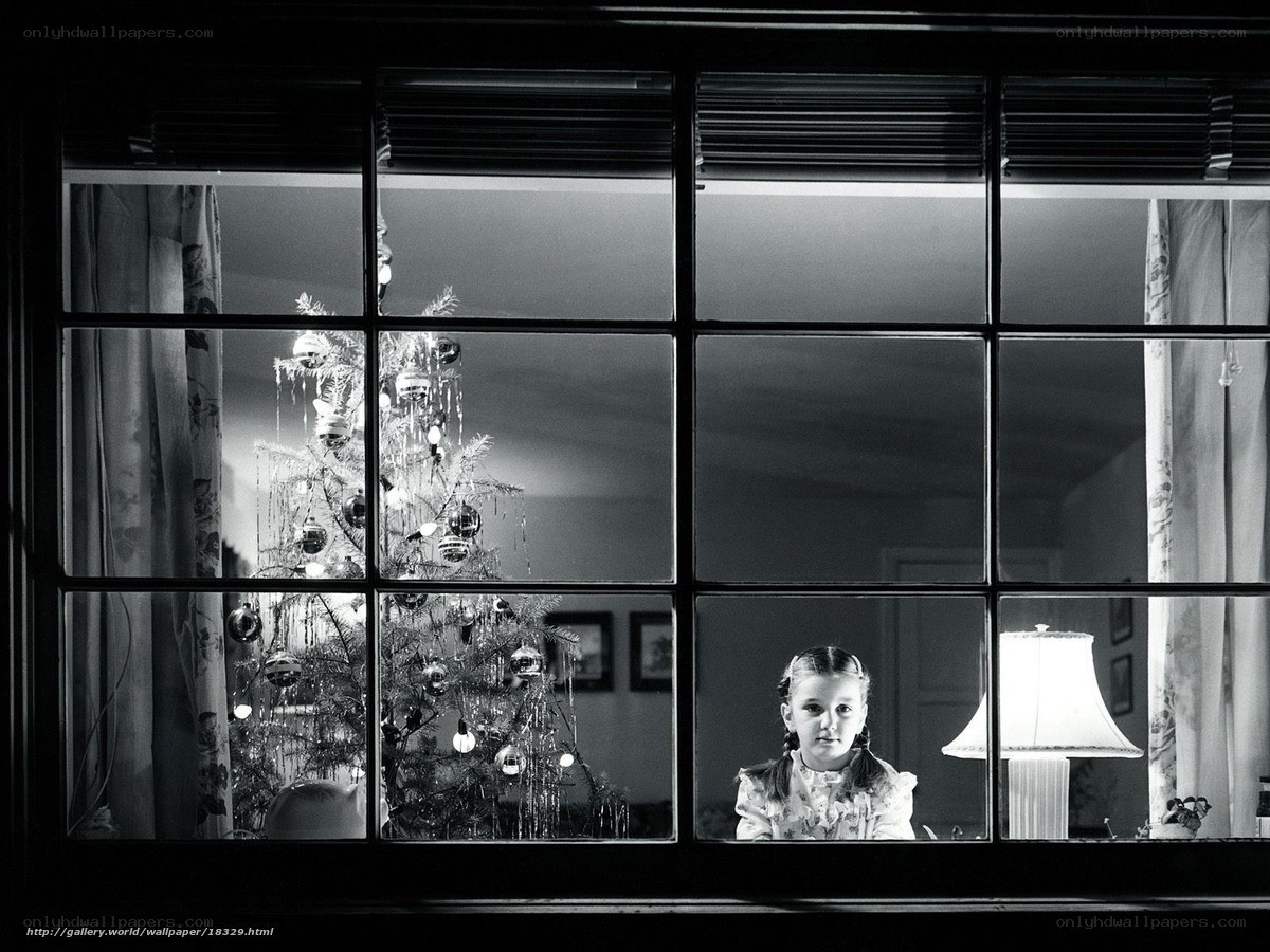 Girl by the Christmas tree