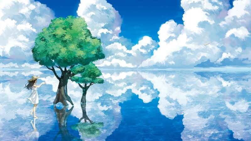 Girl by the tree in a dreamy landscape
