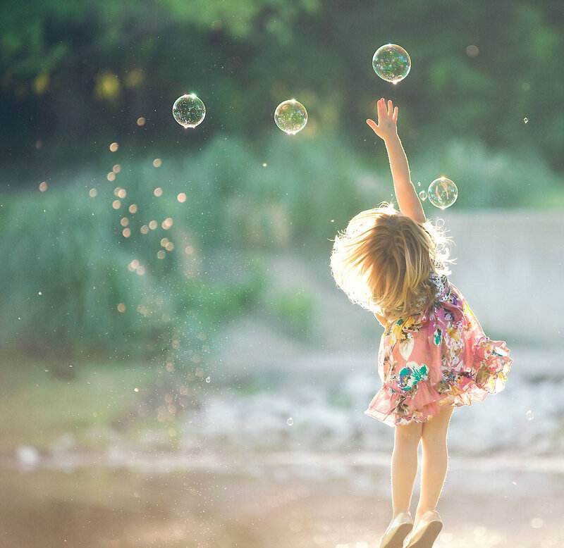 Girl Chasing Bubbles