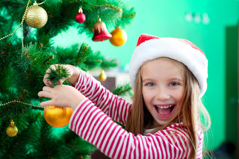 Girl Decorating Christmas Tree — Green, Joyful
