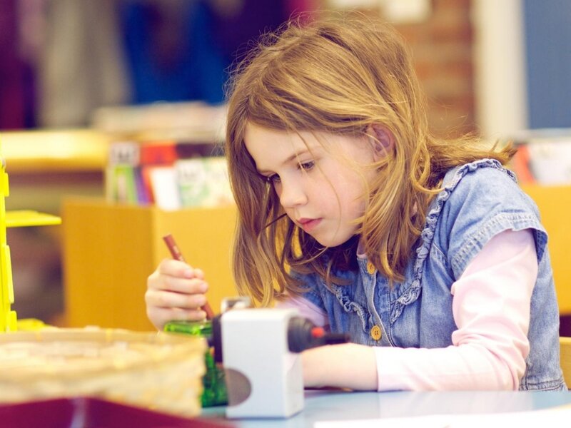 Girl Drawing at Table — Blue