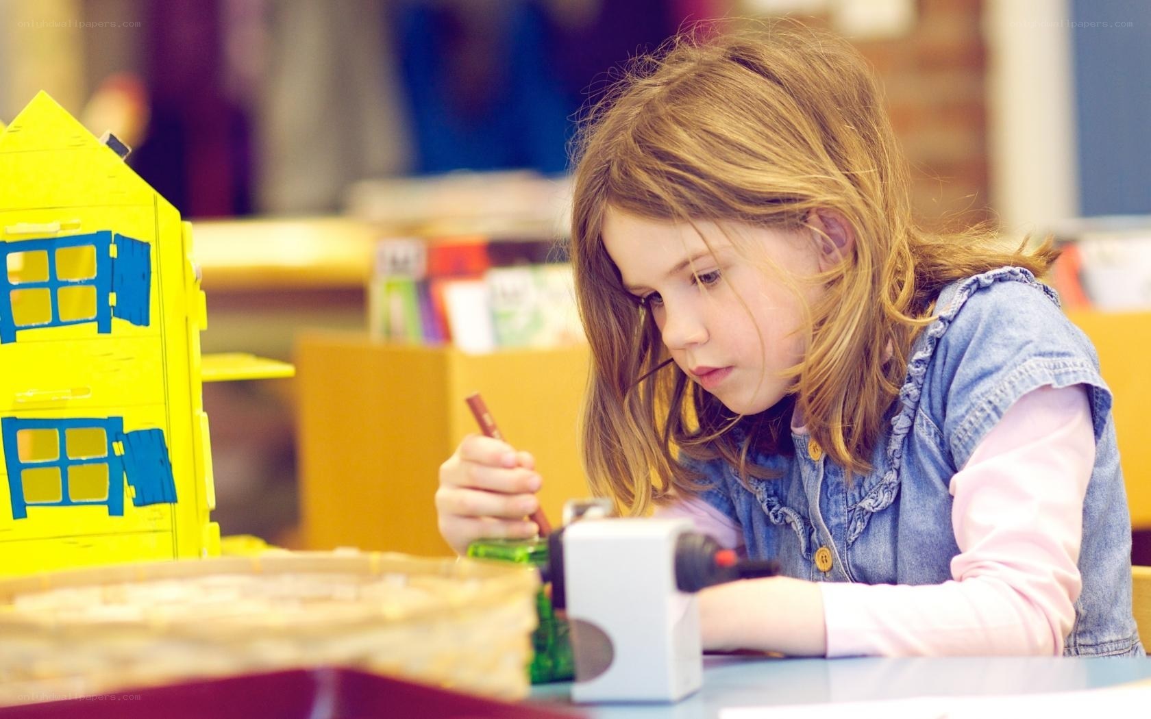 girl drawing at table