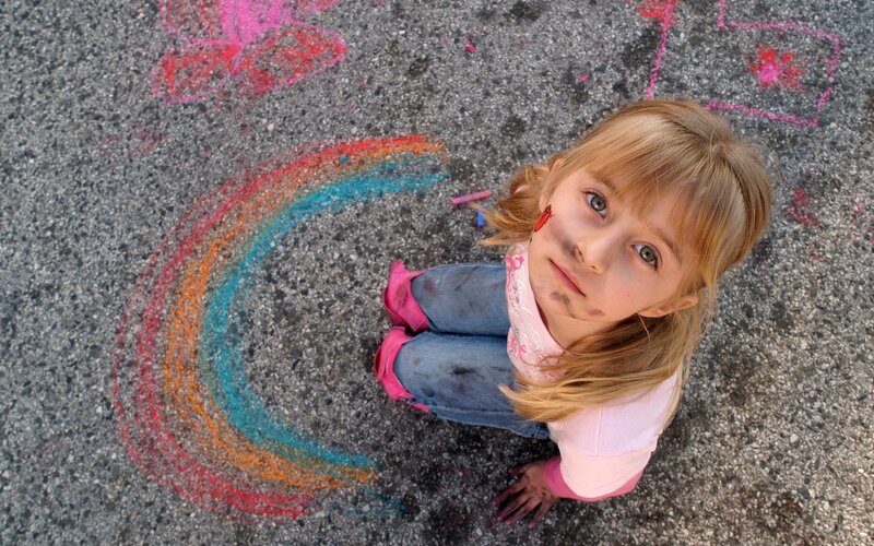 girl drawing with chalk