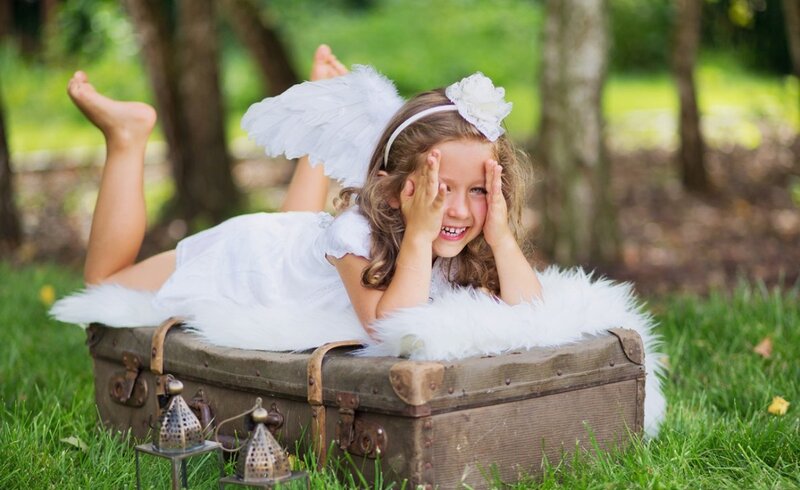 Girl Dressed as an Angel — White, Playful