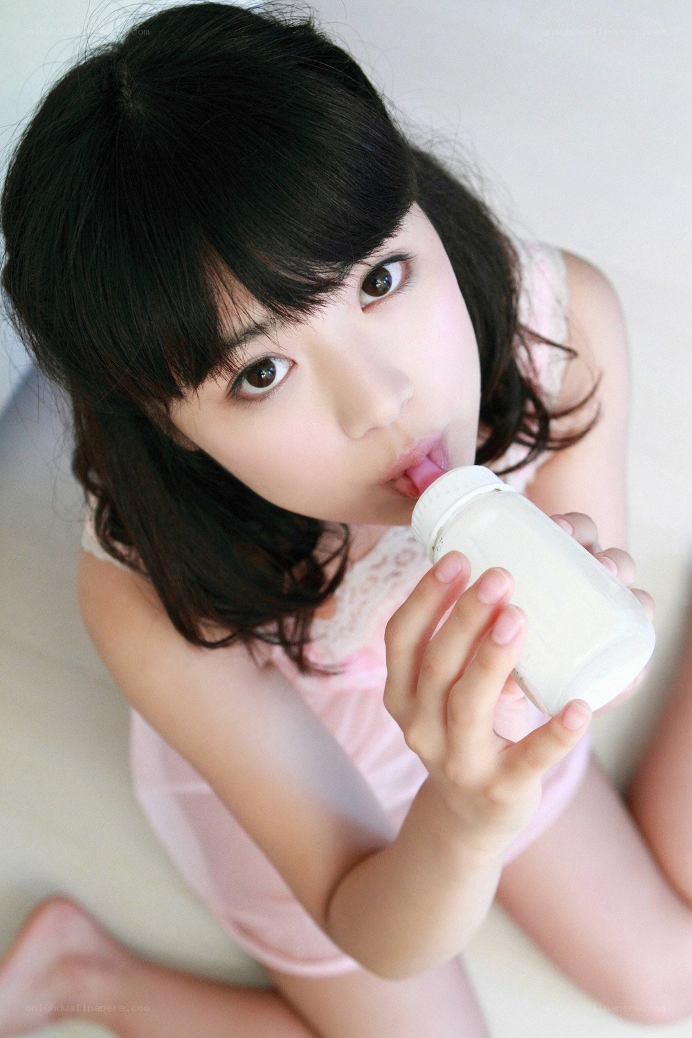 girl drinking from a bottle
