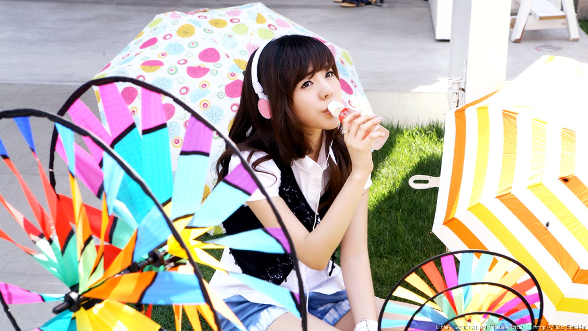 girl drinking with headphones