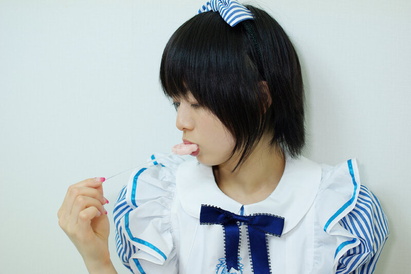 girl eating a lollipop