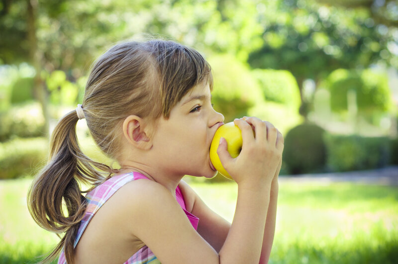 Girl Eating Apple — Green, Serene, Afternoon, Photograph