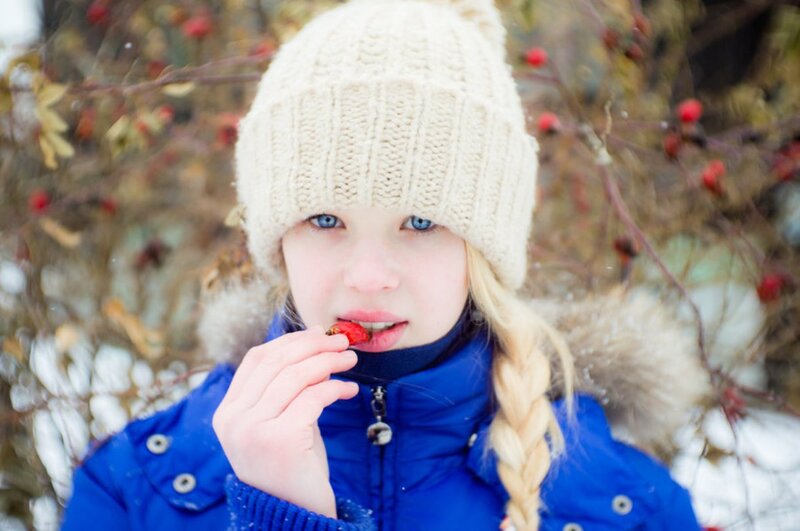 Girl Eating Berry