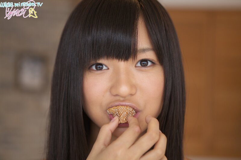 girl eating sesame snack