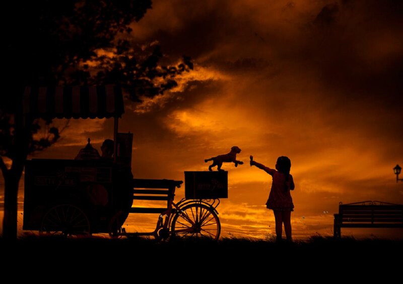Girl Feeding Dog
