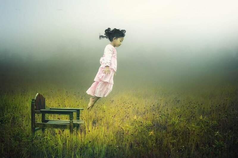 Girl Floating in Field