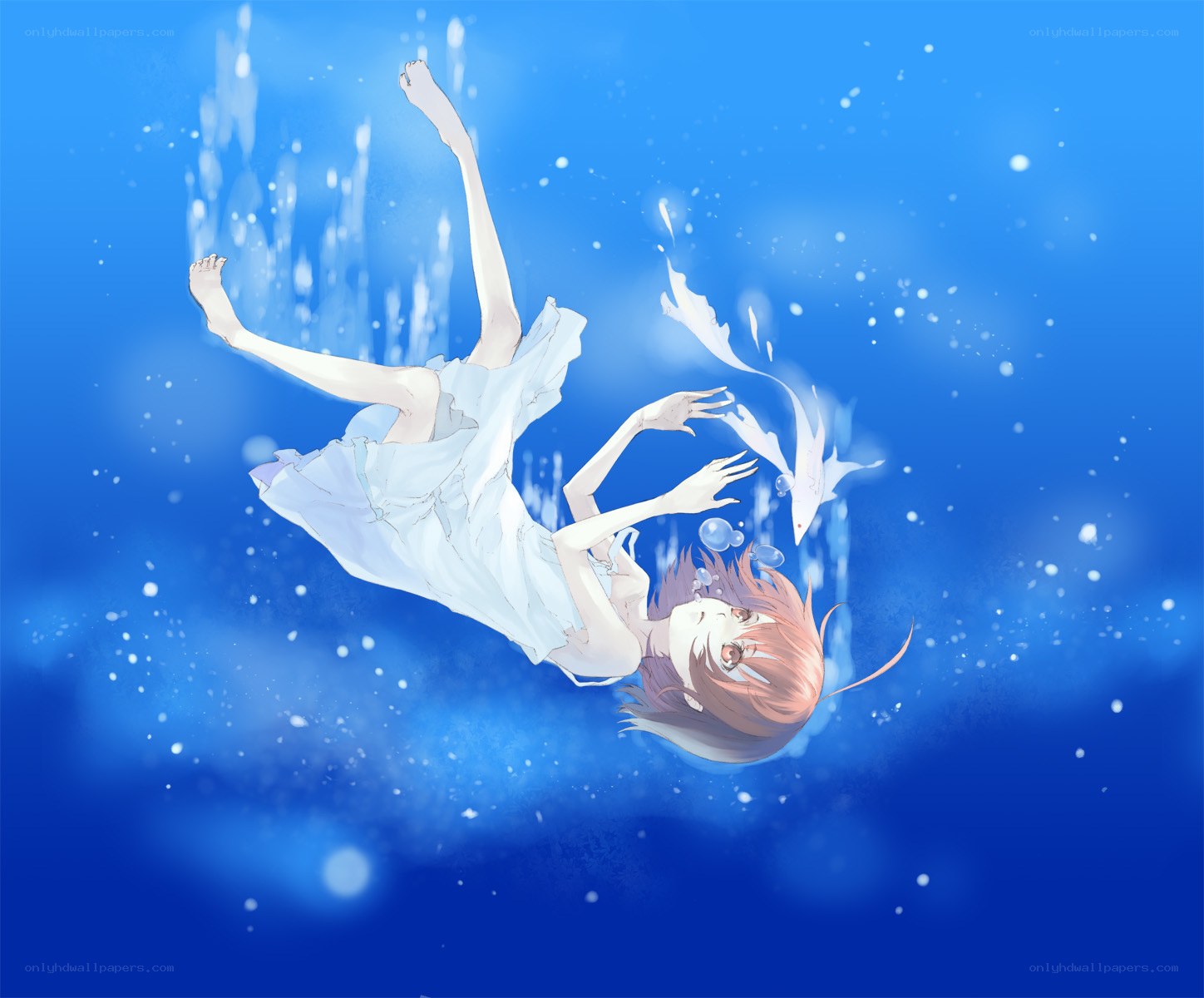 girl floating underwater