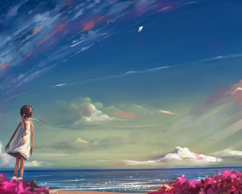 Girl flying a kite at the beach