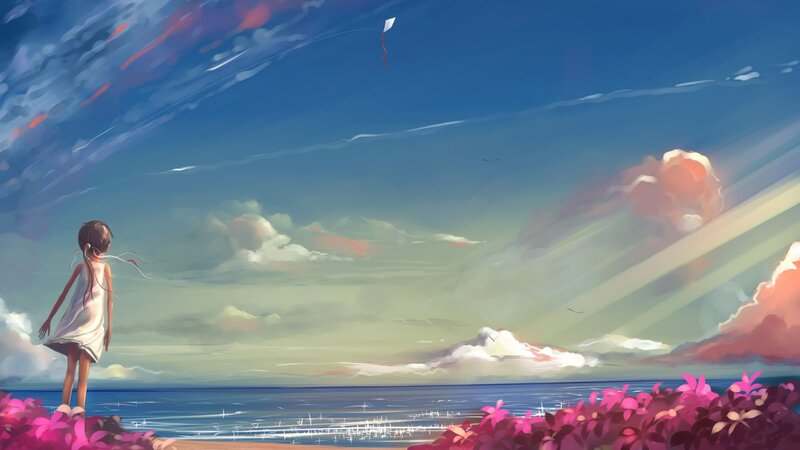 Girl flying a kite at the beach