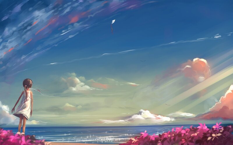 Girl flying a kite at the beach