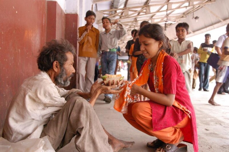 Girl Giving Food to Man