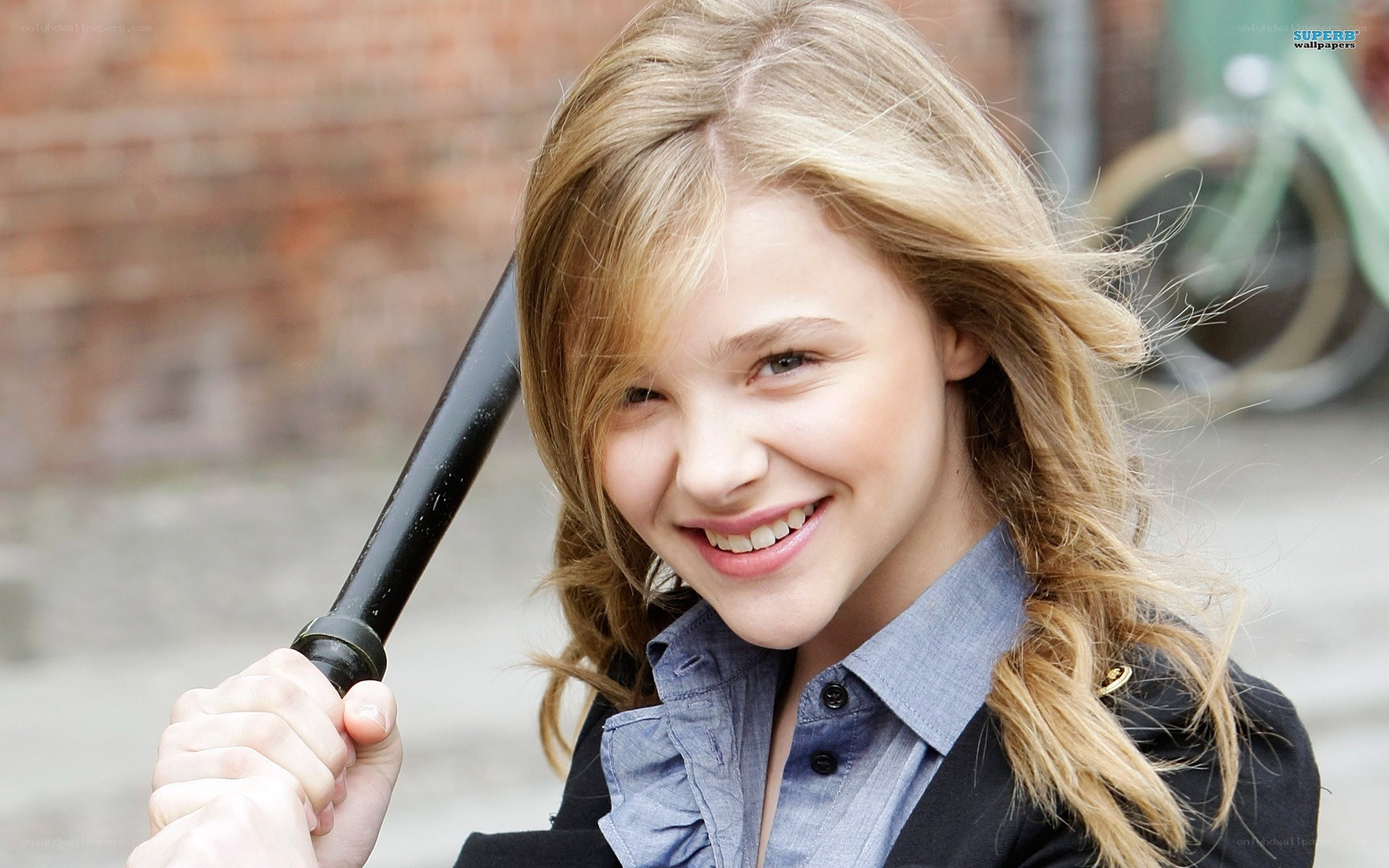 girl holding a bat