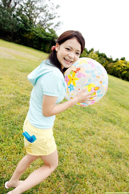 Girl holding a beach ball