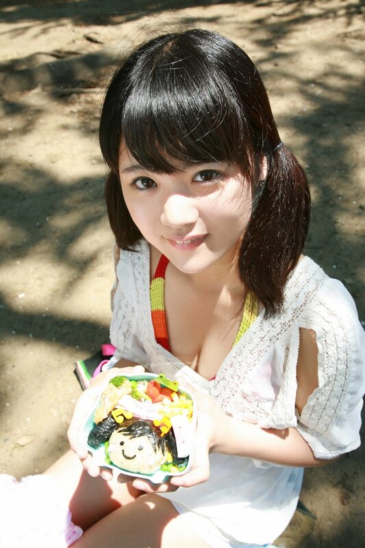 Girl holding a bento box