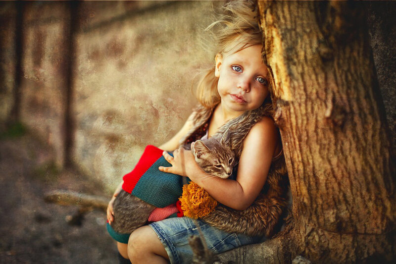 Girl Holding a Cat — Brown