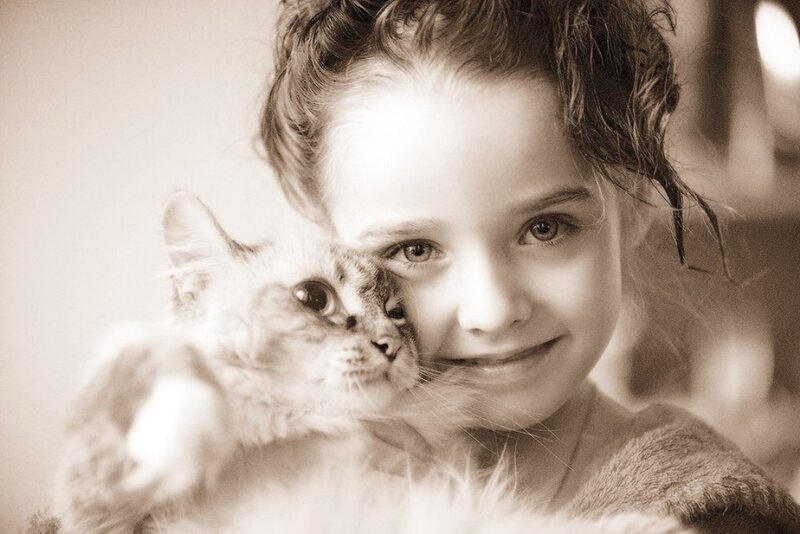 Girl Holding a Cat — Sepia