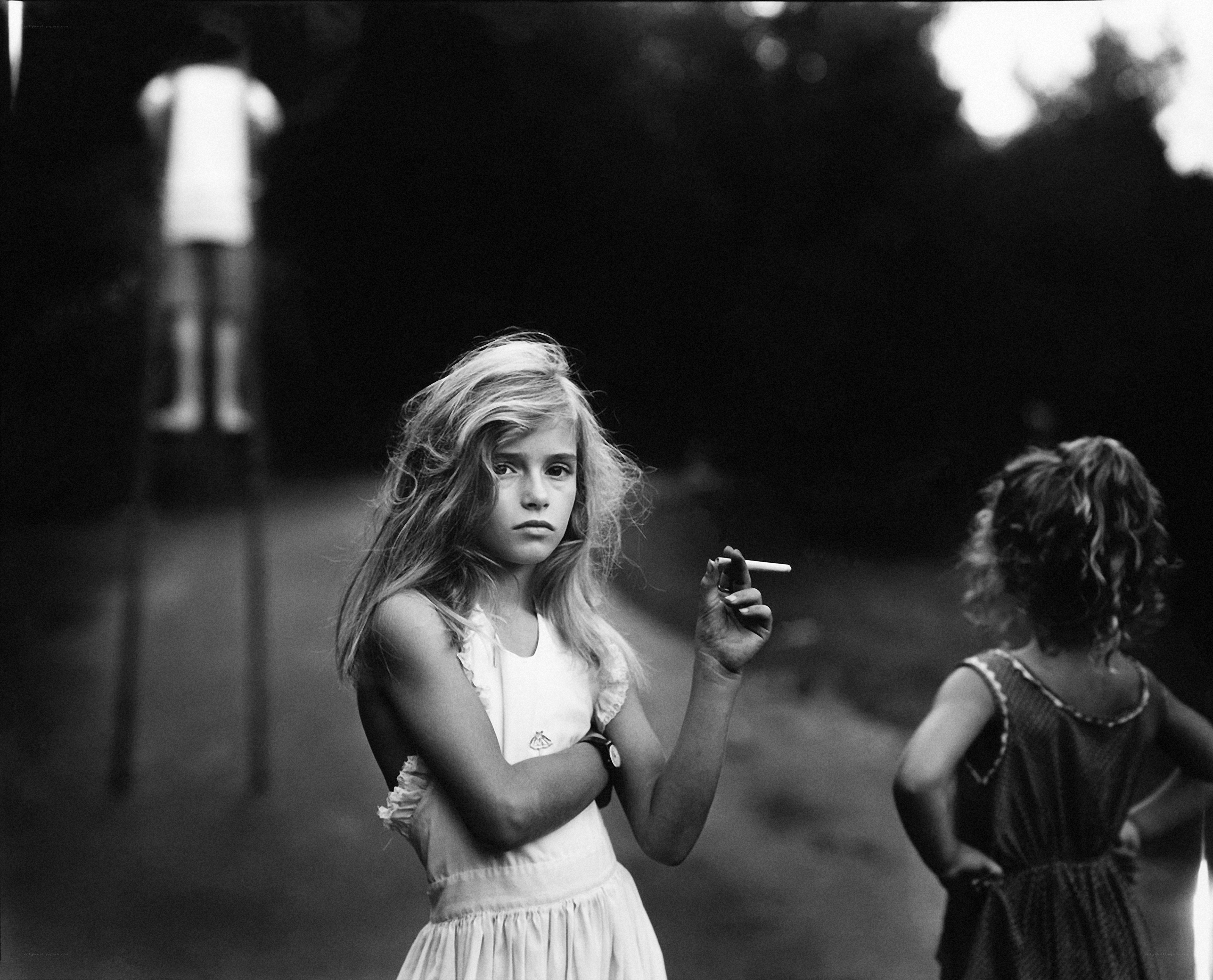 Girl holding a cigarette