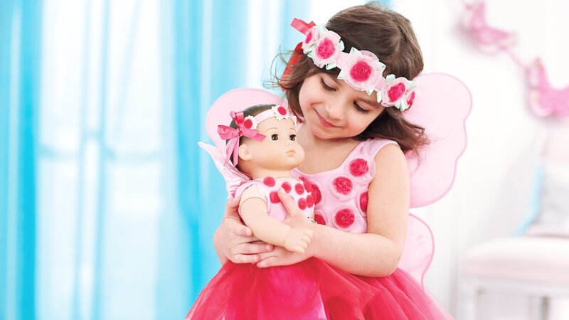 Girl Holding a Doll — Pink, Playful