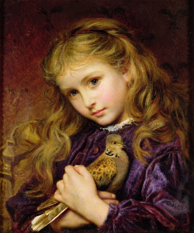 Girl holding a dove