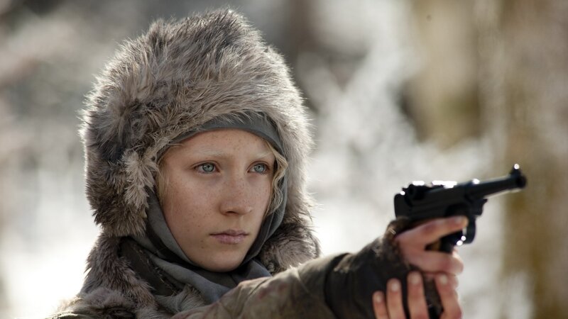 girl holding a gun in winter