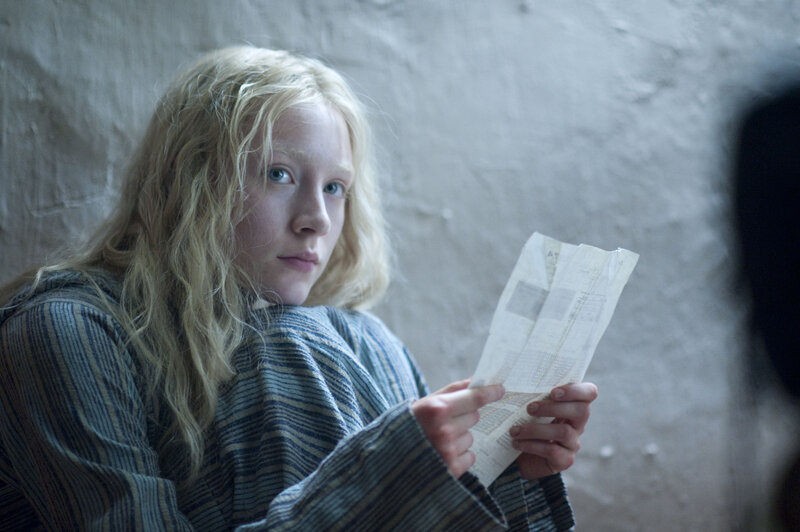 girl holding a letter