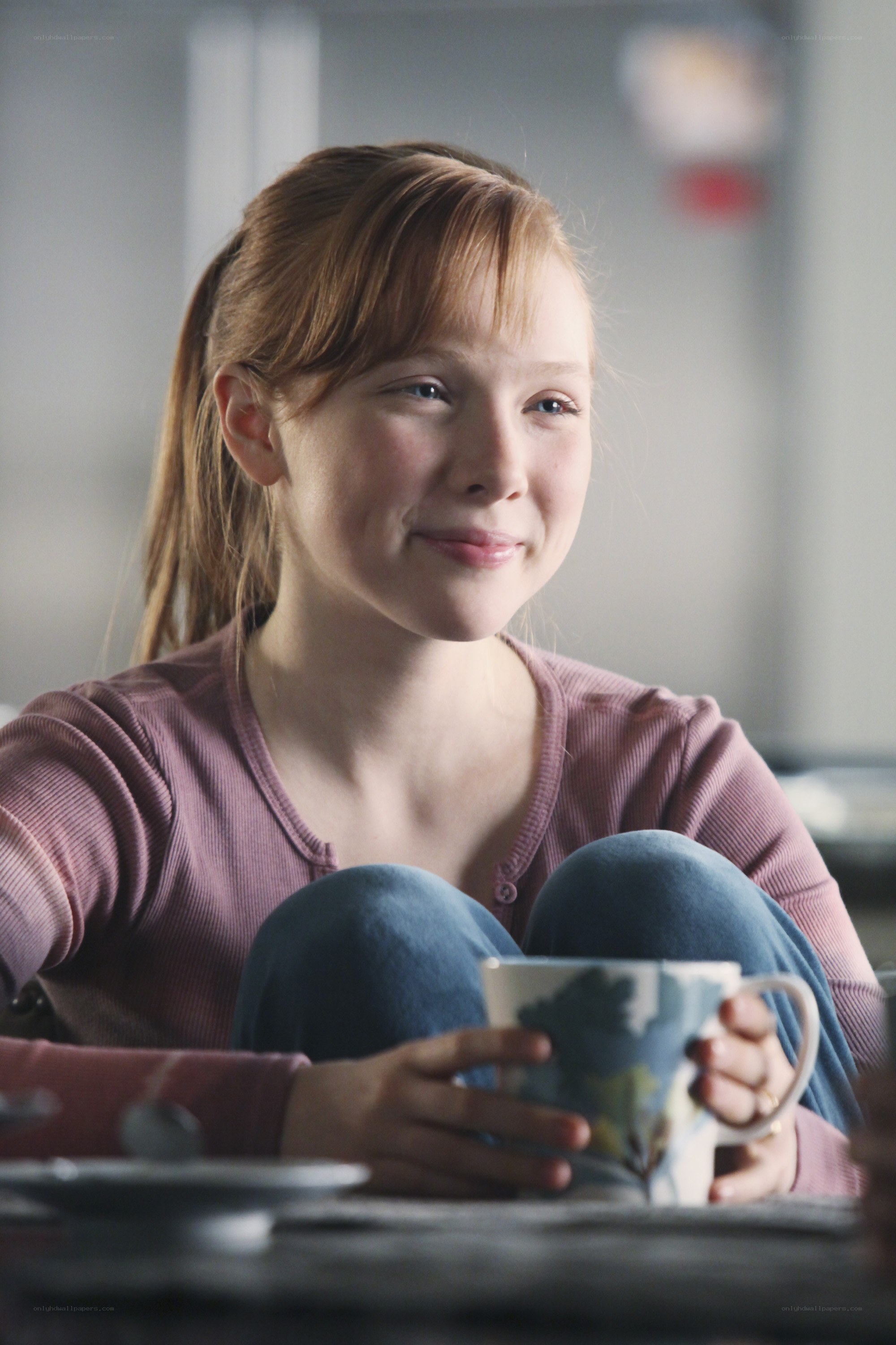 girl holding a mug