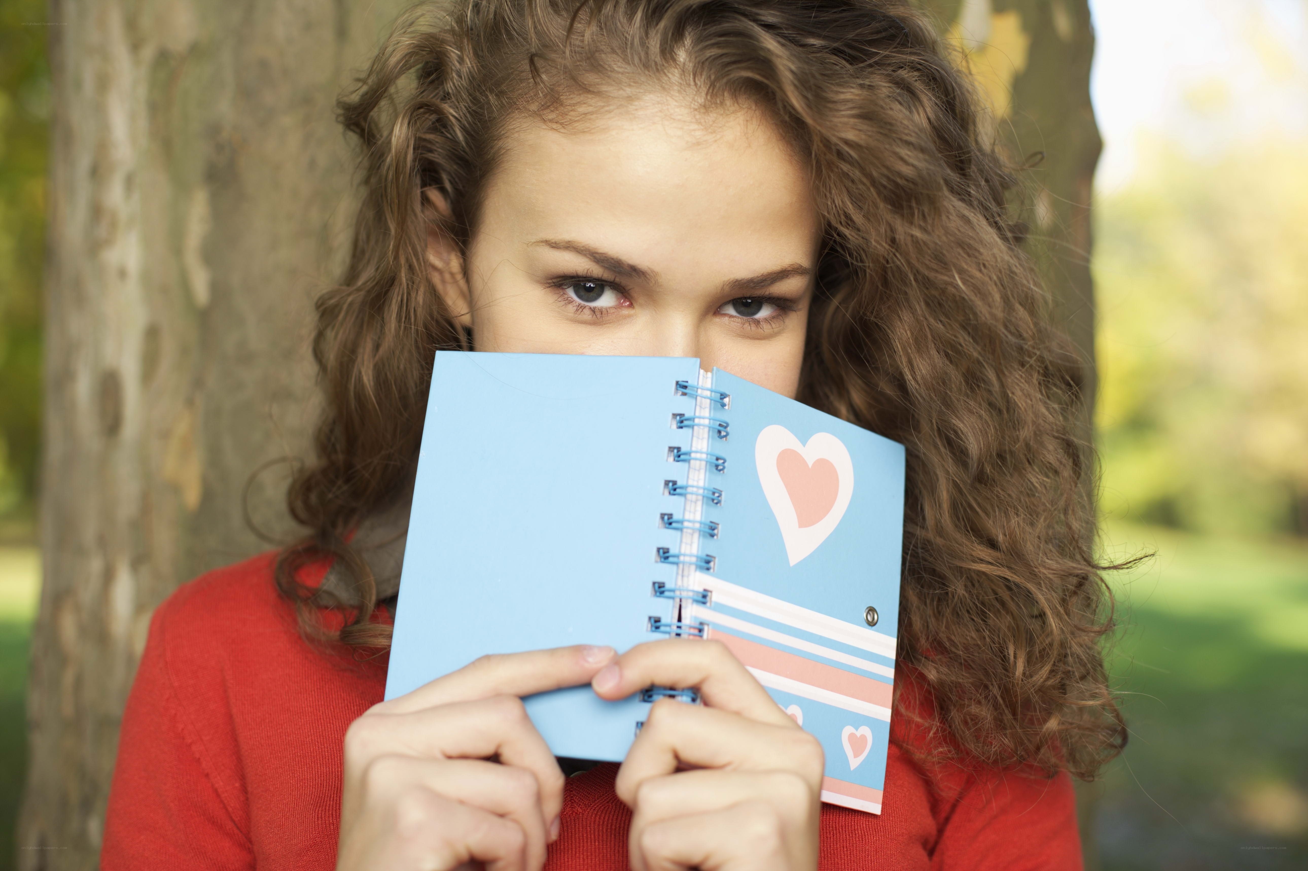 girl holding a notebook