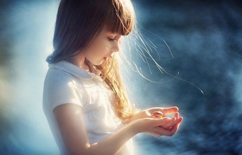 Girl Holding a Shell
