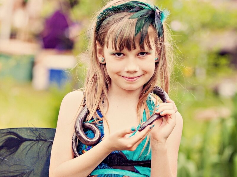 Girl Holding a Snake — Green