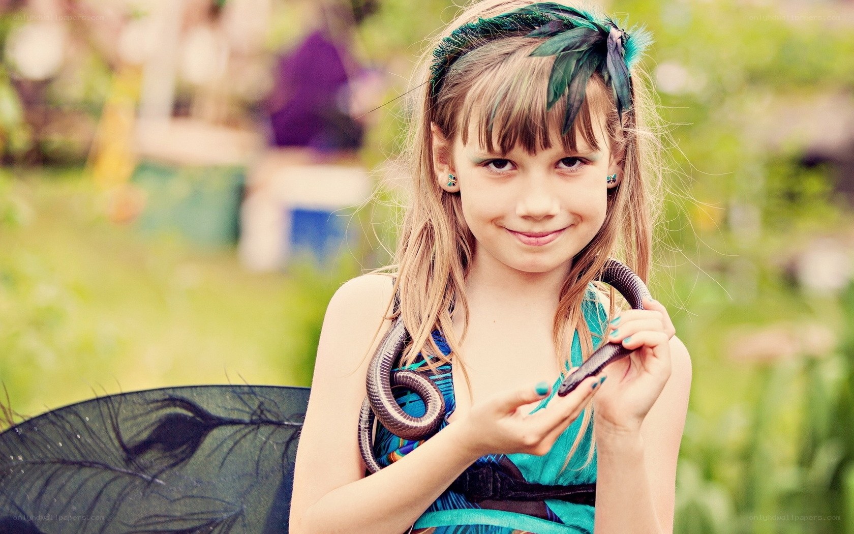 girl holding a snake