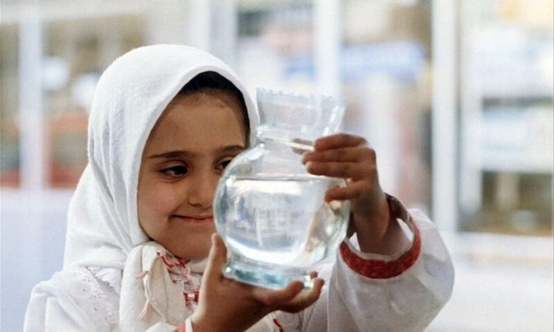 girl holding a water jar