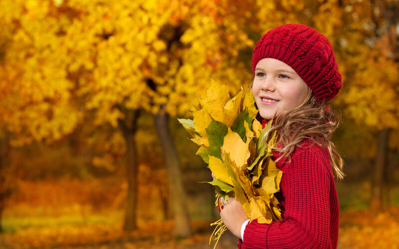 Girl Holding Autumn Leaves — Red