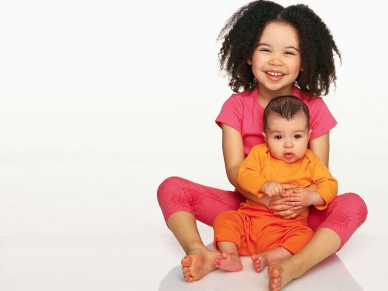 Girl Holding Baby