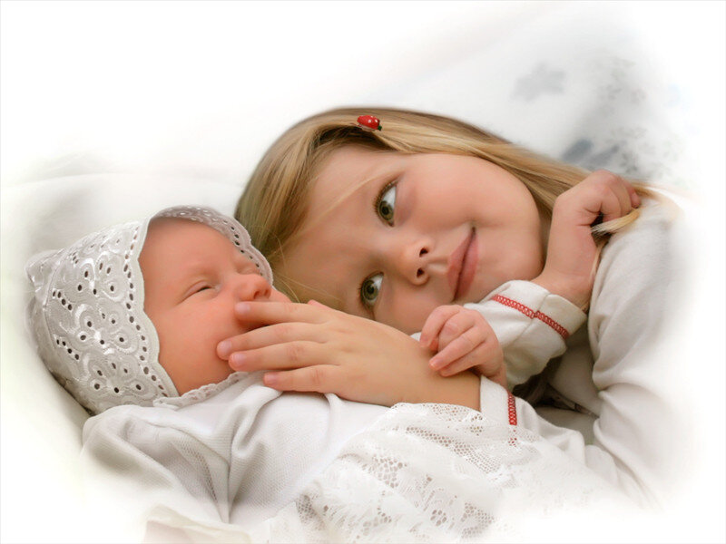 Girl Holding Baby — White