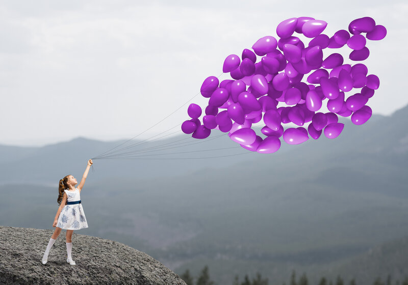 Girl Holding Balloons — Purple