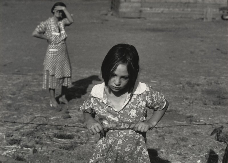 Girl holding barbed wire